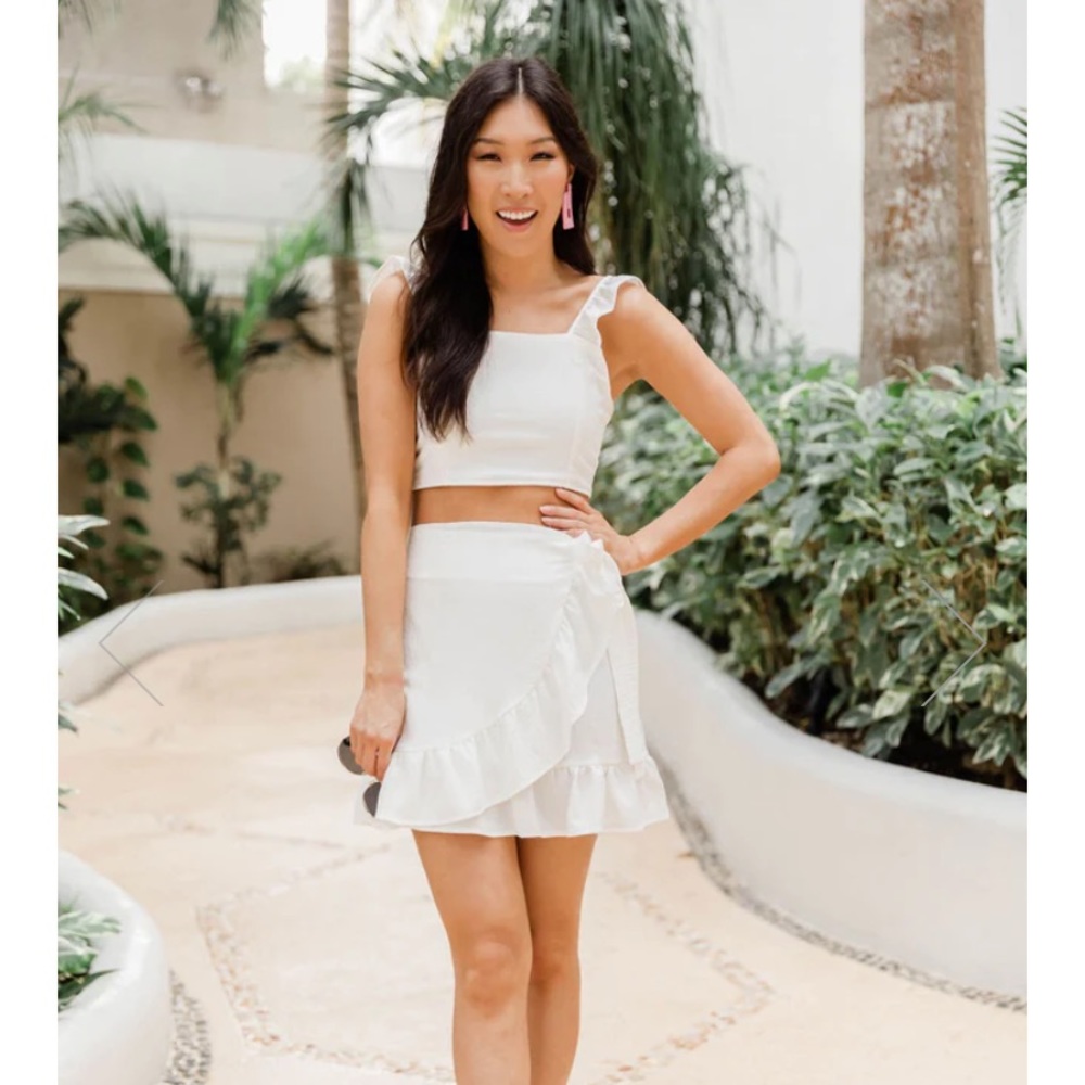 Brand new, never worn Pink Lily white two-piece set. Crop top and skirt.